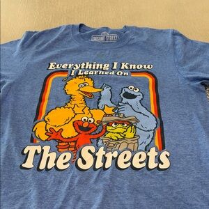 Men’s small Sesame Street Blue Tee with Iconic Characters